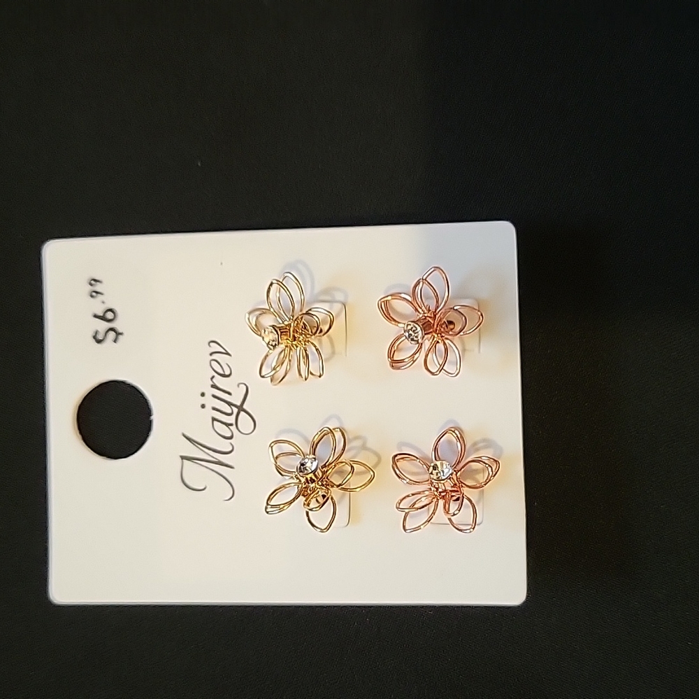 Brand new flower shape earrings.  One pair gold and other rose gold.